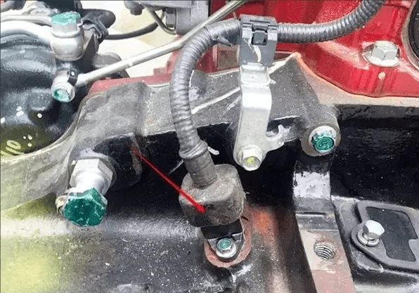 main engine speed sensor location on the KOBELCO excavator engine